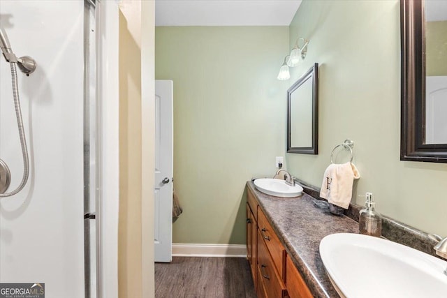 bathroom with vanity and wood-type flooring