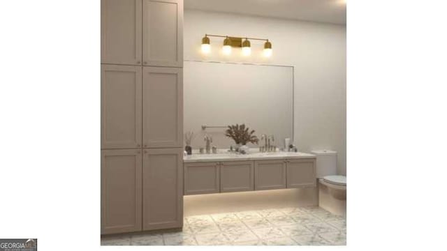 60 Douglas St SE, Atlanta, GA 30317 - bathroom featuring toilet, double vanity, and tile patterned floors
