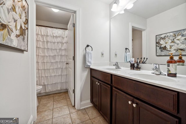 bathroom with a shower with curtain, vanity, toilet, and tile patterned flooring