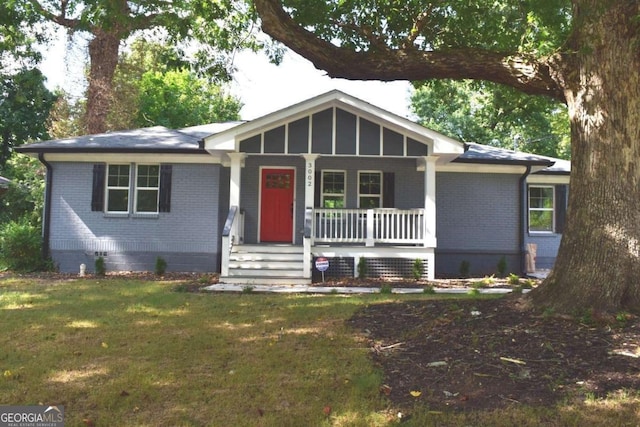 ranch-style house with a front lawn and a porch