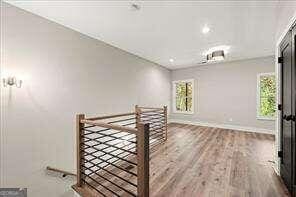 interior space with hardwood / wood-style floors and plenty of natural light