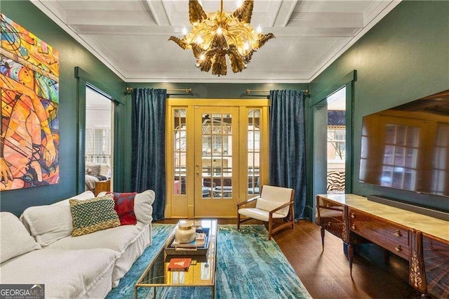 sitting room featuring wood-type flooring, coffered ceiling, an inviting chandelier, and beam ceiling