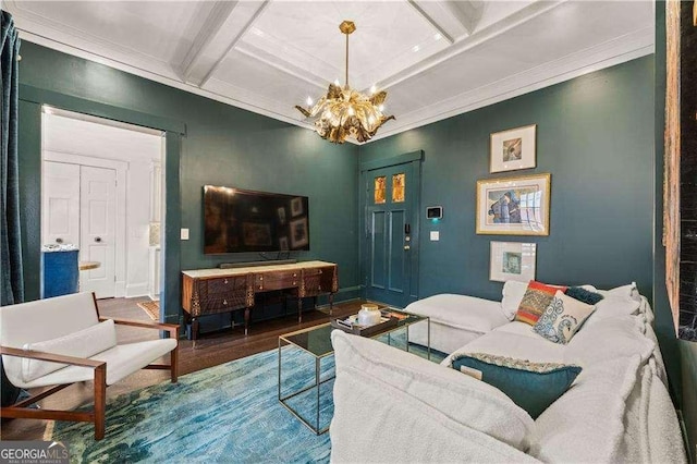 living room featuring hardwood / wood-style floors, beamed ceiling, a chandelier, ornamental molding, and coffered ceiling