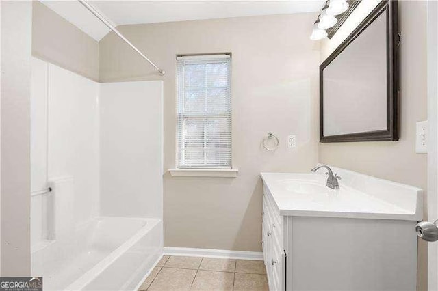 bathroom with tile patterned flooring, vanity, and washtub / shower combination