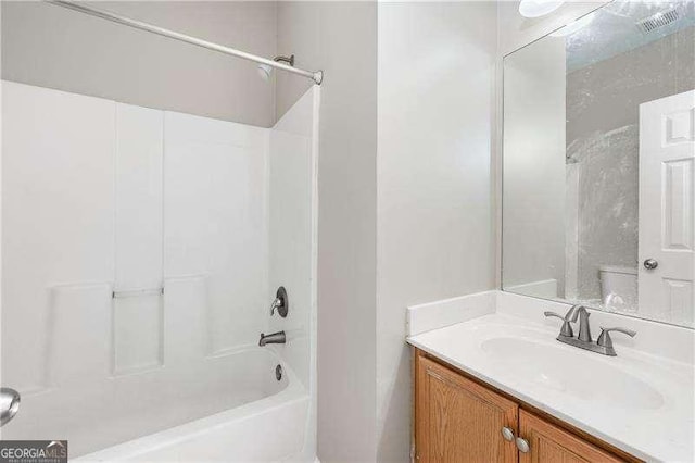 full bathroom featuring shower / tub combination, vanity, and toilet