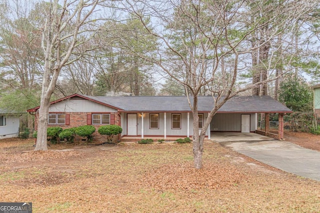 ranch-style home featuring a carport