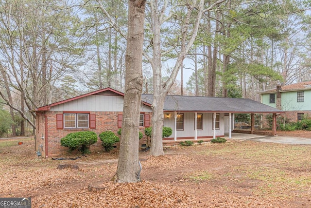 view of front of house with a carport and covered porch