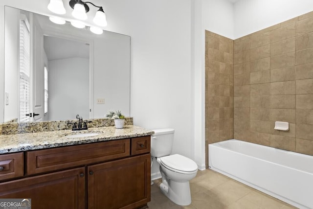 full bathroom with tiled shower / bath combo, vanity, toilet, and tile patterned flooring