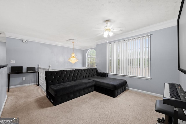 carpeted living room with crown molding and ceiling fan