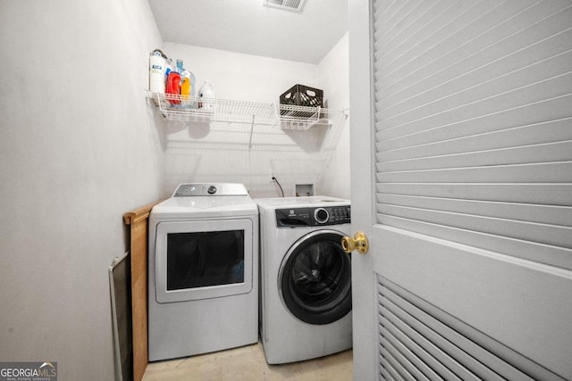 washroom featuring separate washer and dryer