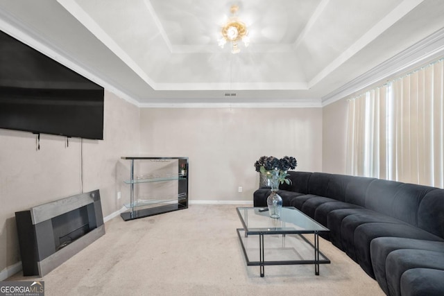 living room with carpet flooring and a raised ceiling