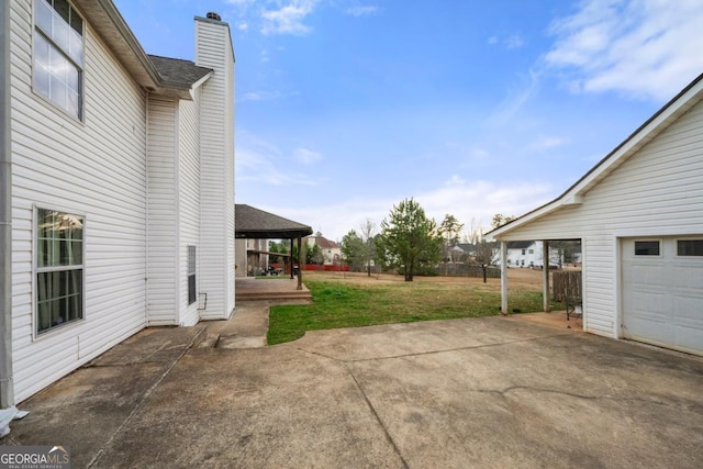 view of patio featuring a garage