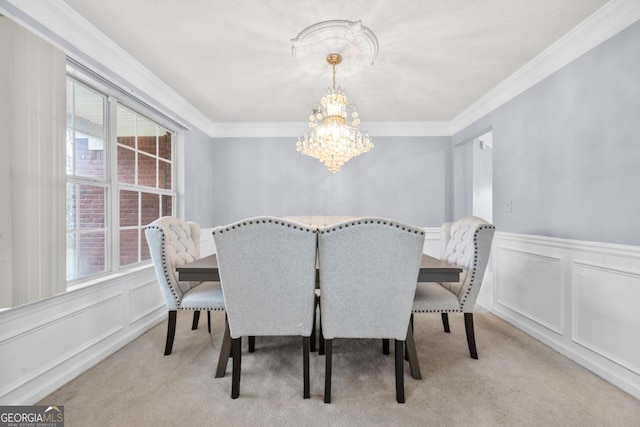 carpeted dining area featuring crown molding and a notable chandelier