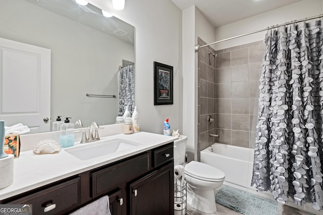 full bath featuring shower / bath combo, visible vents, vanity, and toilet