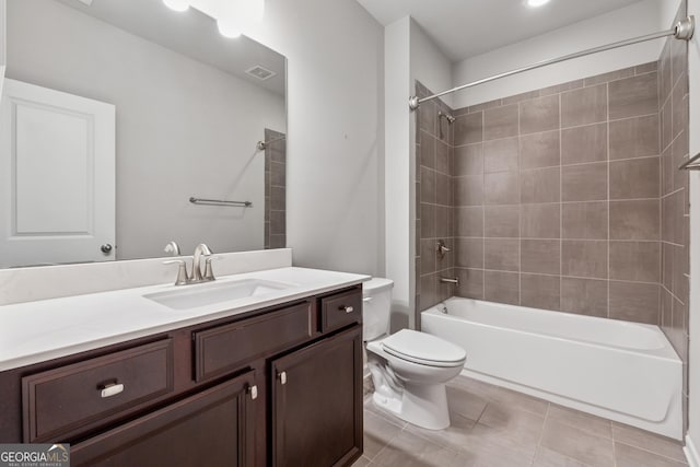 bathroom featuring toilet, shower / bathing tub combination, visible vents, tile patterned flooring, and vanity