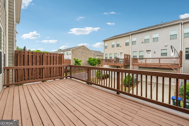 wooden deck with a residential view