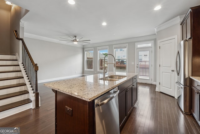 kitchen featuring a sink, ceiling fan, dark brown cabinetry, appliances with stainless steel finishes, and ornamental molding