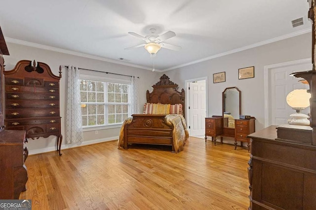 bedroom with ornamental molding, ceiling fan, and light hardwood / wood-style flooring