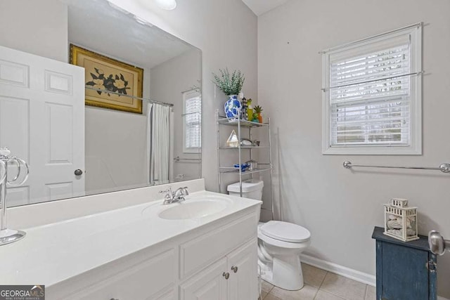 bathroom with a shower with curtain, vanity, tile patterned floors, and toilet