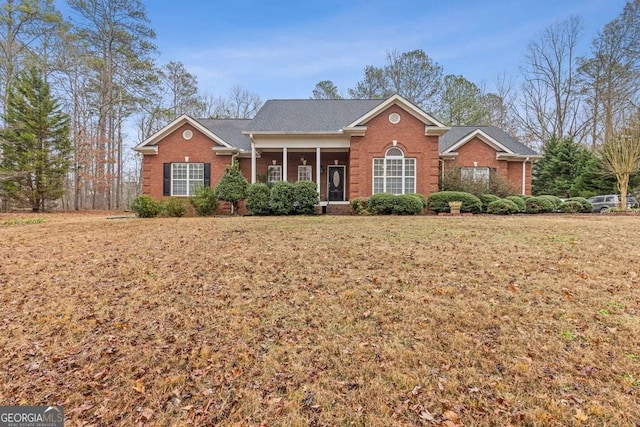 single story home featuring a front yard