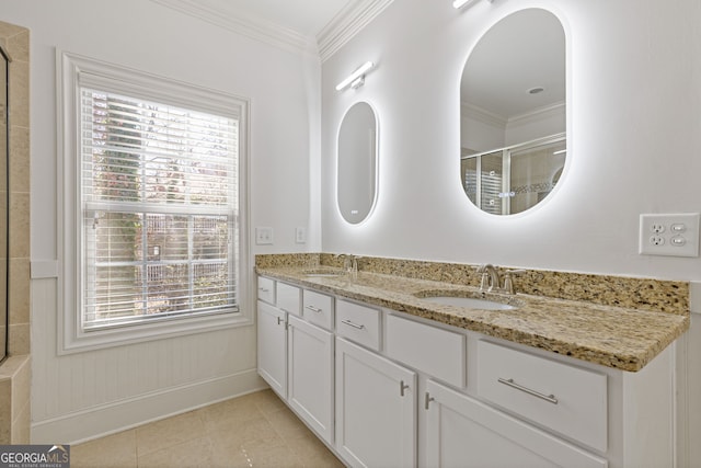 full bath with crown molding, a sink, and tile patterned floors