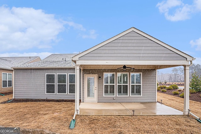 back of property with a patio and ceiling fan