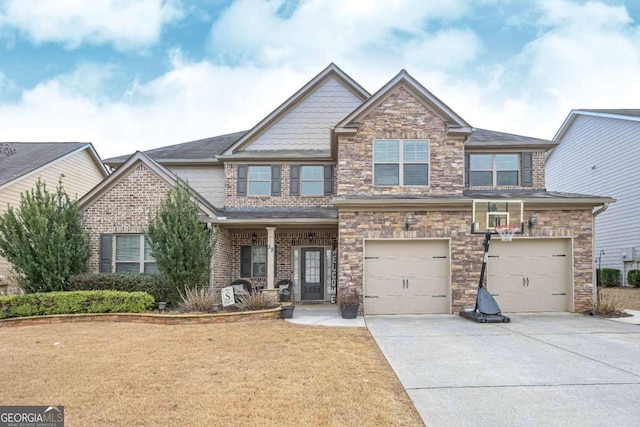 craftsman inspired home featuring a garage and a front yard