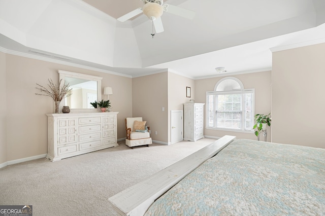 bedroom with a raised ceiling, ornamental molding, carpet flooring, and ceiling fan