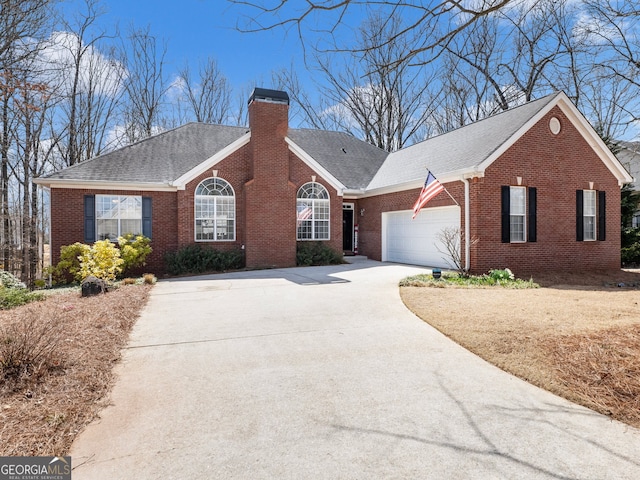 ranch-style home featuring brick siding, concrete driveway, a chimney, and a garage