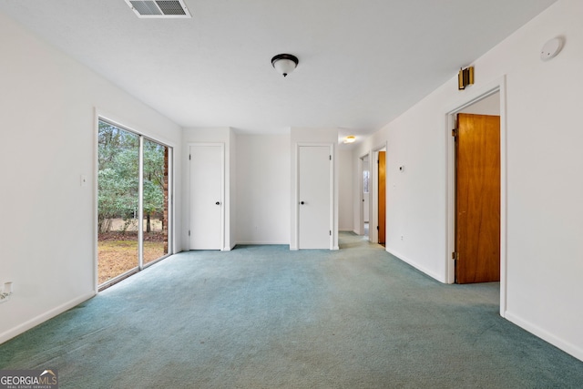 unfurnished room featuring carpet