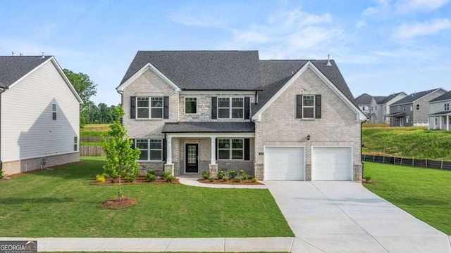 view of front of house featuring a garage, a porch, and a front lawn