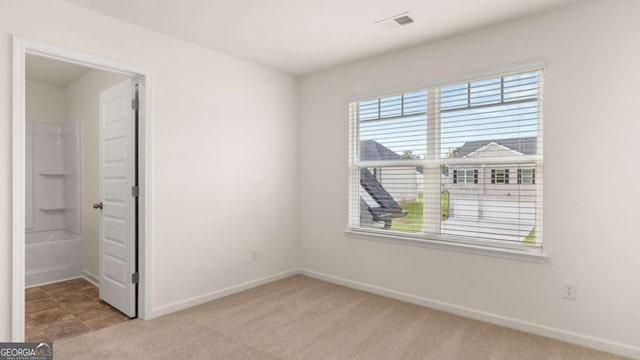 unfurnished bedroom with light carpet