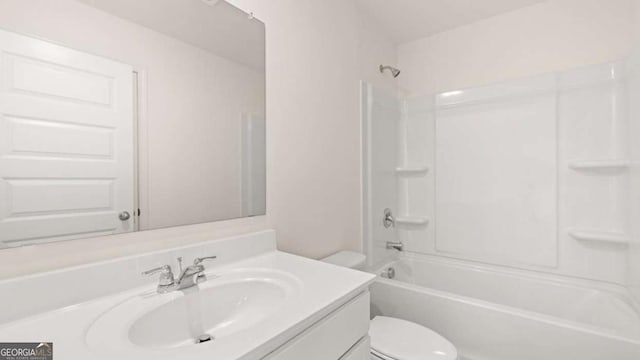 full bathroom featuring toilet, vanity, and bathtub / shower combination