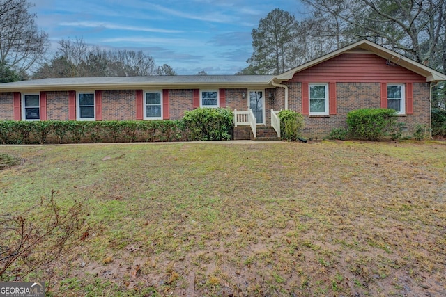 ranch-style house with a front lawn