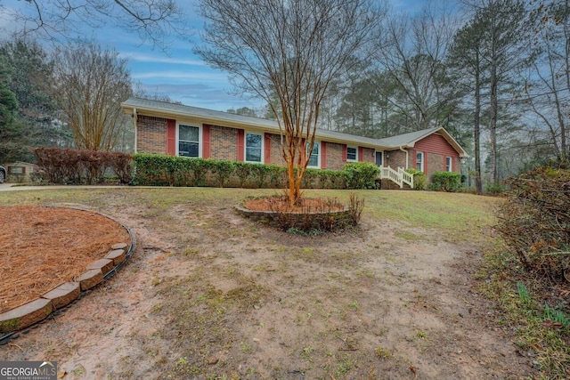 ranch-style house with a front yard