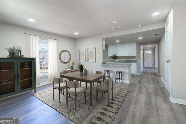 dining space with light hardwood / wood-style floors