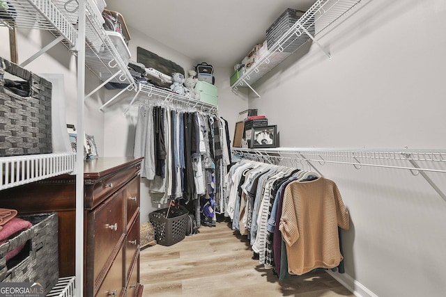 walk in closet featuring light hardwood / wood-style floors