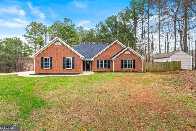 ranch-style home featuring a front yard