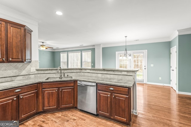 100 Windmeadow Way, Fayetteville, GA 30214 - kitchen featuring dishwasher, a sink, ornamental molding, decorative backsplash, and a peninsula