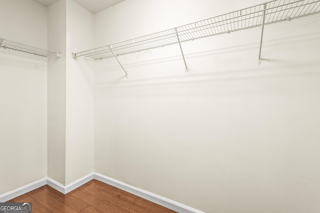 spacious closet with wood finished floors