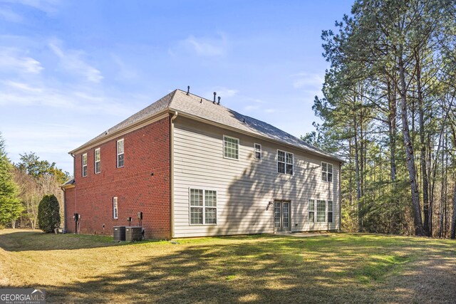 100 Windmeadow Way, Fayetteville, GA 30214 - view of home's exterior with a lawn, brick siding, and central air condition unit