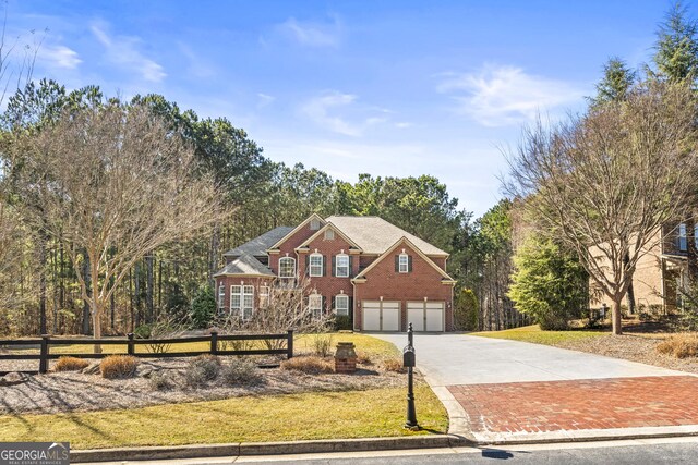 100 Windmeadow Way, Fayetteville, GA 30214 - traditional home featuring driveway, a garage, and brick siding