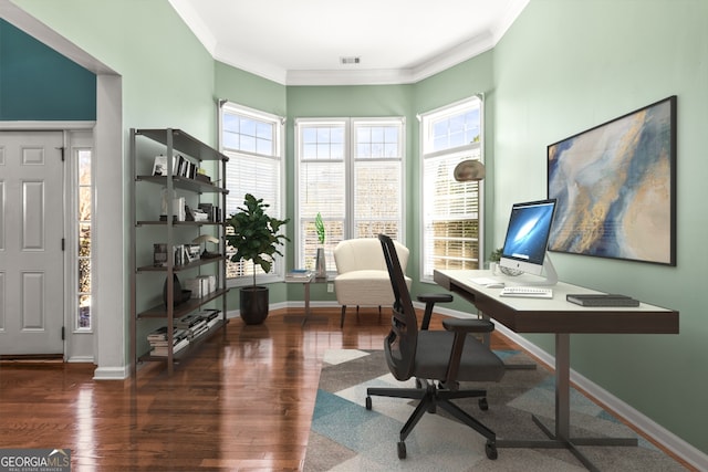 home office featuring baseboards, visible vents, ornamental molding, and wood finished floors