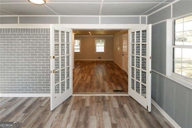 doorway featuring dark hardwood / wood-style floors and french doors