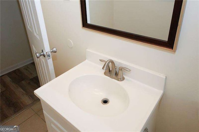 bathroom featuring tile patterned flooring and vanity