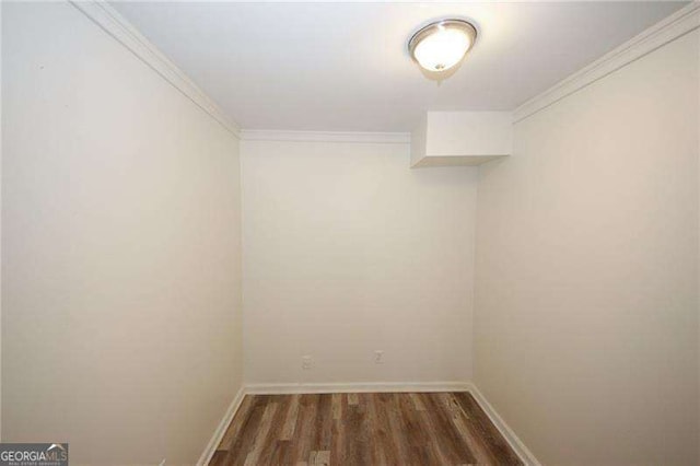 interior space featuring crown molding and dark hardwood / wood-style flooring