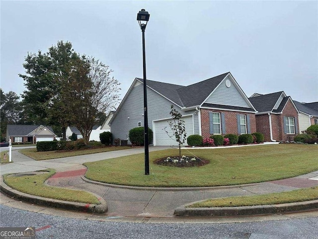 view of front facade with a front lawn and a garage