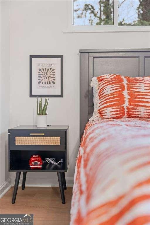 bedroom featuring wood-type flooring