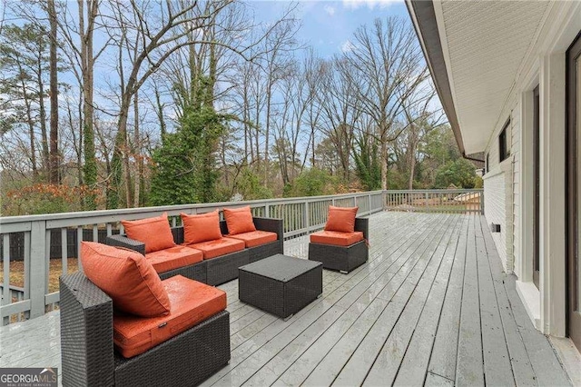 wooden terrace featuring an outdoor living space