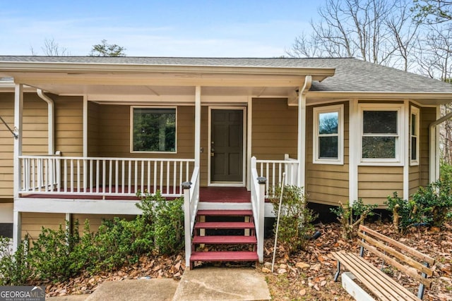 entrance to property featuring a porch